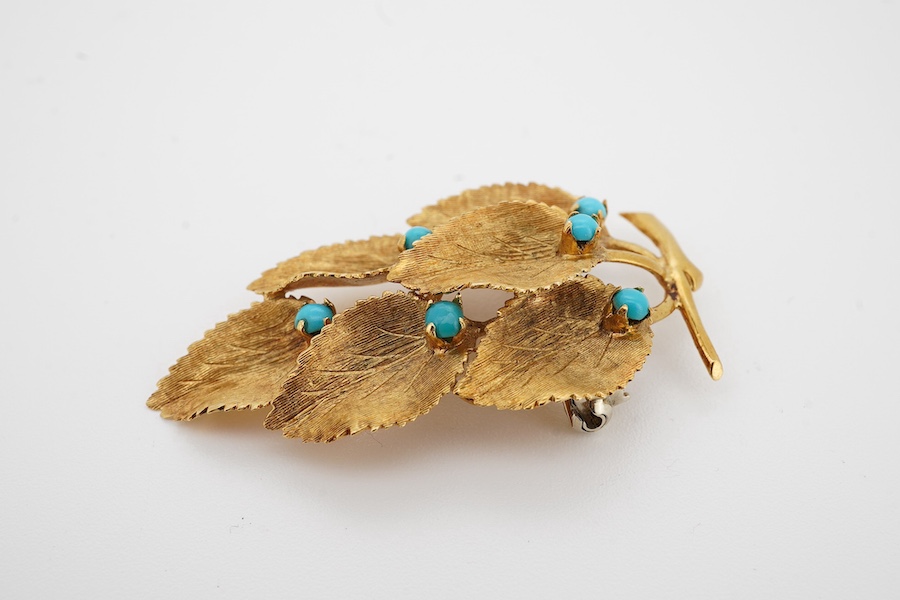 A 1960's 18ct gold and turquoise set leaf brooch, 41mm, gross weight 6.5 grams. Condition - good